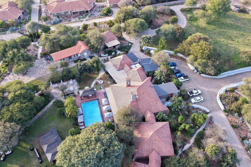 an aerial view of a house with a pool at Kasimba Boutique Hotel in Gaborone