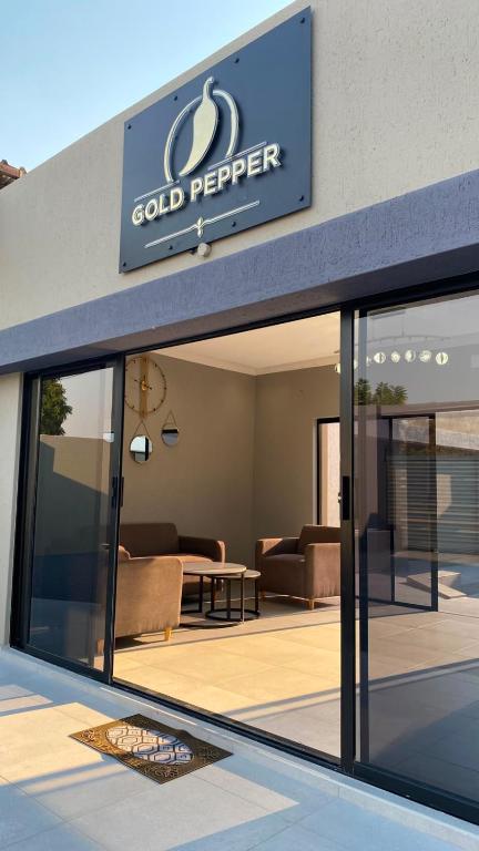 a store front with a sign for cold pepper at Gold Pepper Boutique Guesthouse in Siyabuswa