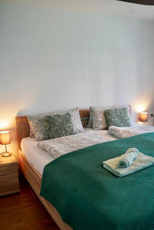 a bed with a dog laying on top of it at PrimeBnb Bad Hersfeld in Bad Hersfeld