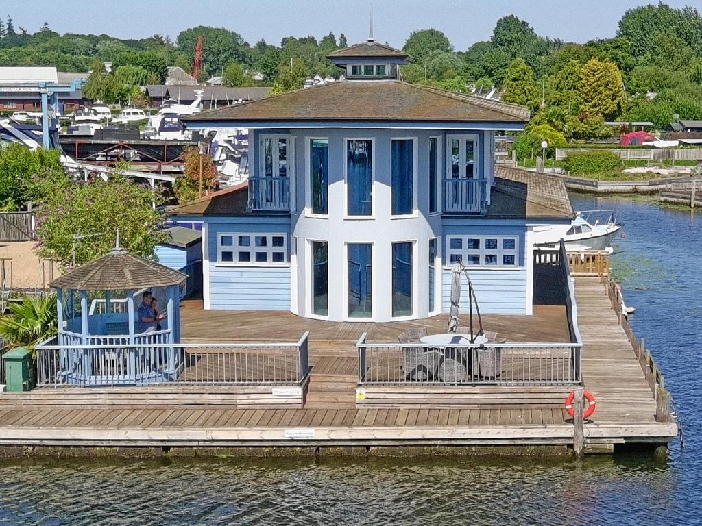 a large house on a dock on the water at Flag House - Ukc7074 in Brundall