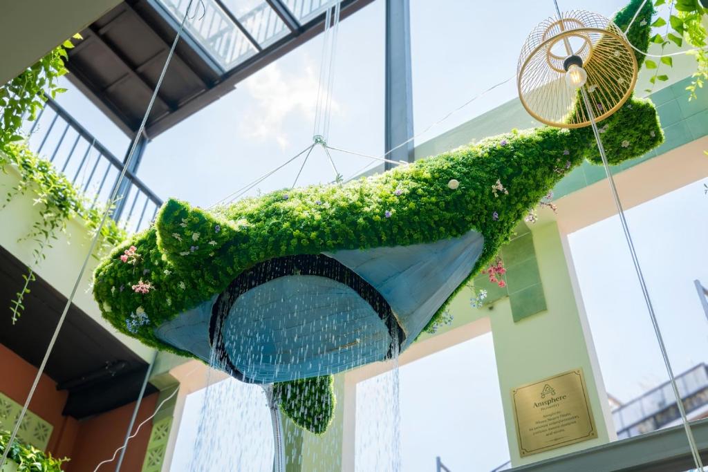a fish hanging from the ceiling of a building at Amsphere Homestay & Restaurant in Hanoi