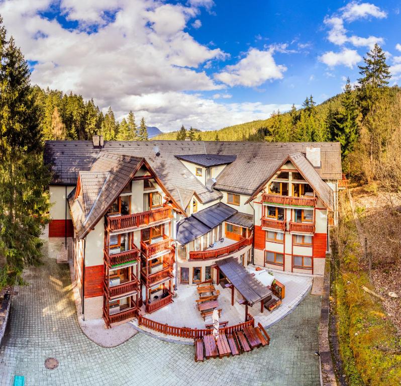 an aerial view of a house with red and white at Apartmánový dom Fatrapark 1 s Wellness - Hlavná recepcia in Ružomberok