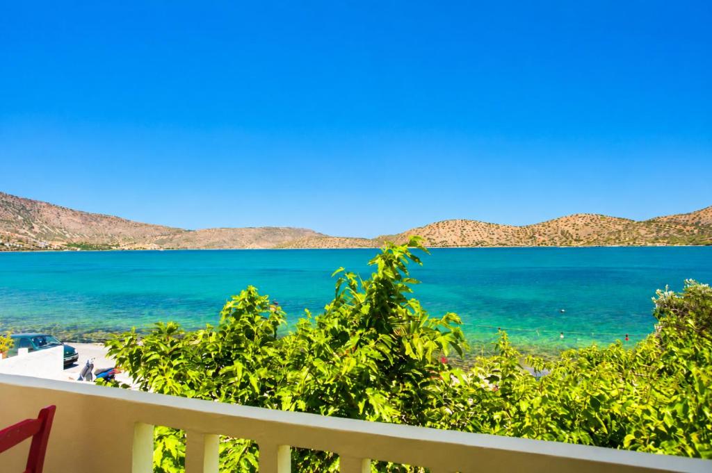 a view of the ocean from a balcony at Christina Boutique Studios Elounda in Elounda