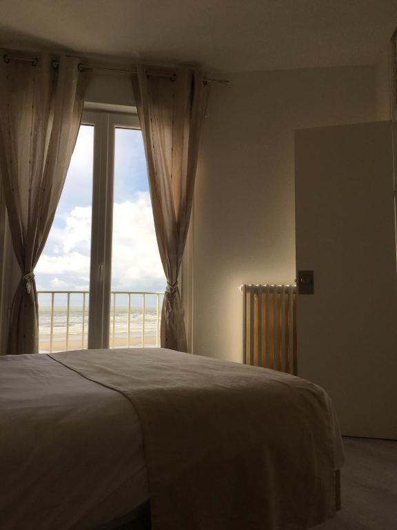 Кровать или кровати в номере Hotel La Terrasse