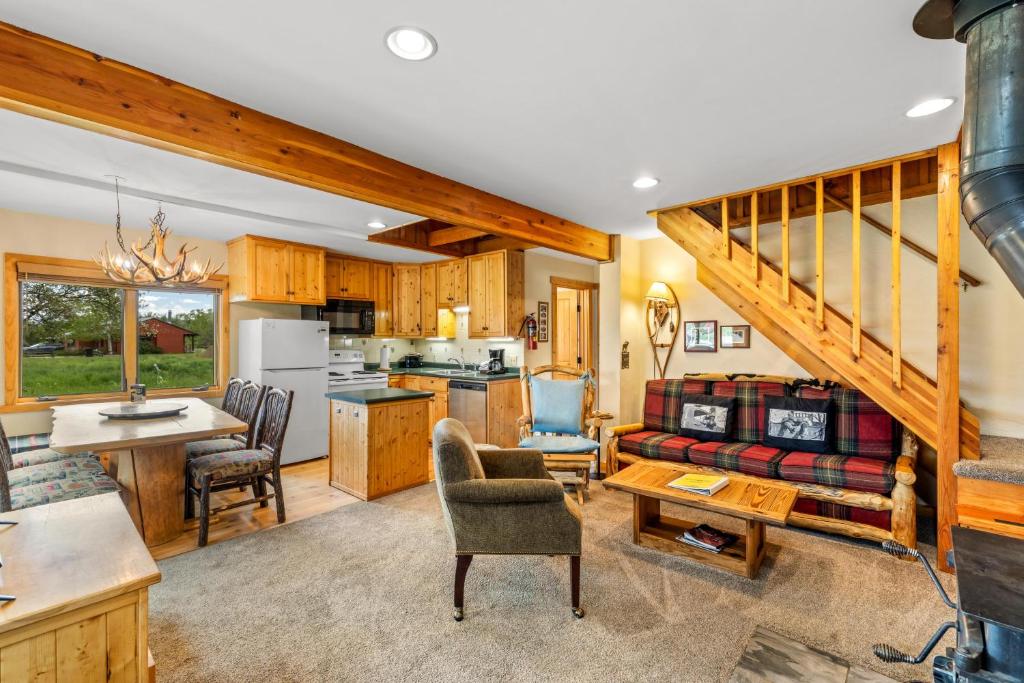 a living room with a couch and a table at Hiker in Clark