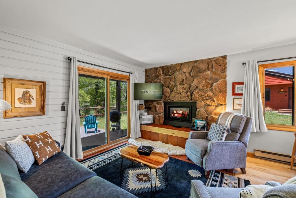a living room with a stone wall at Wintersong in Clark