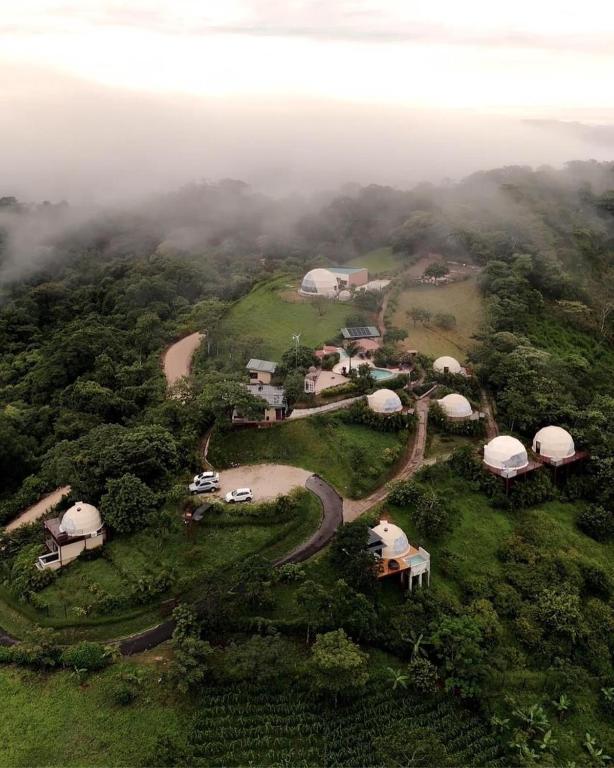 an aerial view of a group of tents on a hill at Kintiri Glamping in Nicoya
