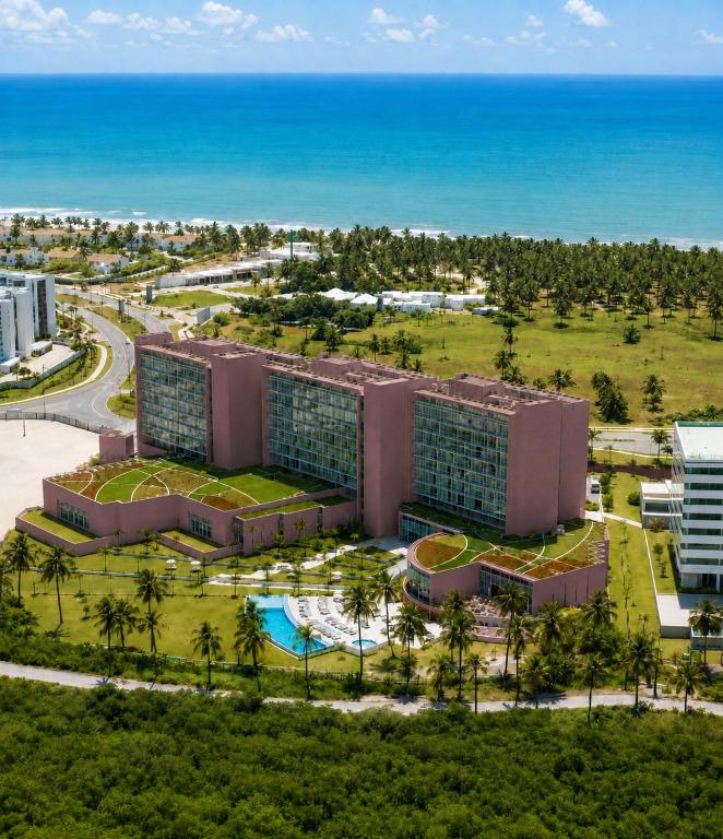an aerial view of a resort with the ocean in the background at Vila Gale Reserva do Paiva in Cabo de Santo Agostinho