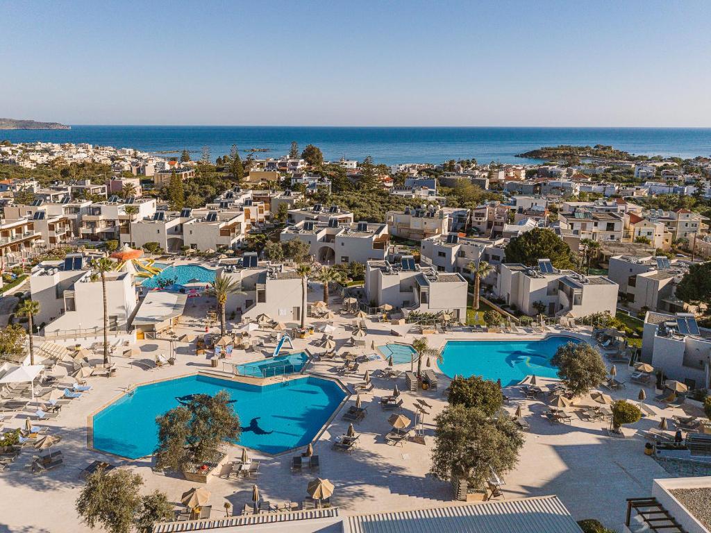 an aerial view of a resort with two pools at Sirios Village Hotel & Bungalows - All Inclusive in Kato Daratso