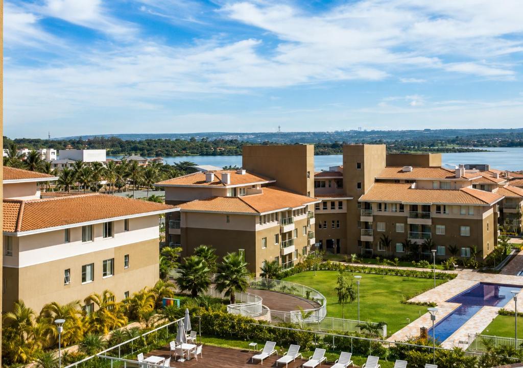 an aerial view of a resort with palm trees and buildings at The Sun Full Condominiun in Brasília