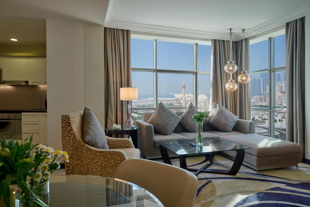 a living room with a couch and a table at Gulf Executive Residence in Manama