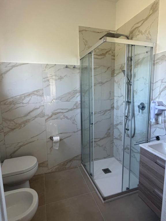 a bathroom with a shower and a toilet at Dimora Guariglia in San Mauro Cilento