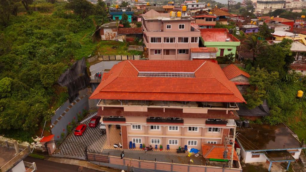 an overhead view of a building with an orange roof at Laalis crest Coorg Madikeri in Madikeri
