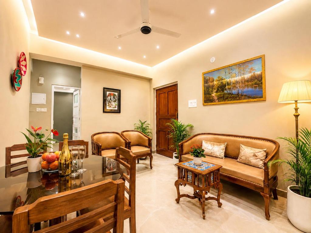 a living room with a couch and a table at MILANO By The Beach Goa in Benaulim