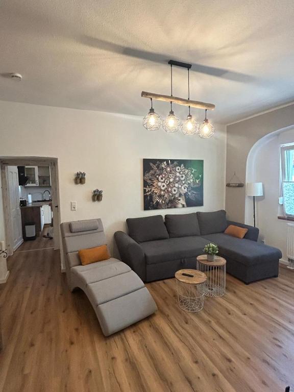 a living room with a couch and a table at Alte Schmiede Karden in Treis-Karden