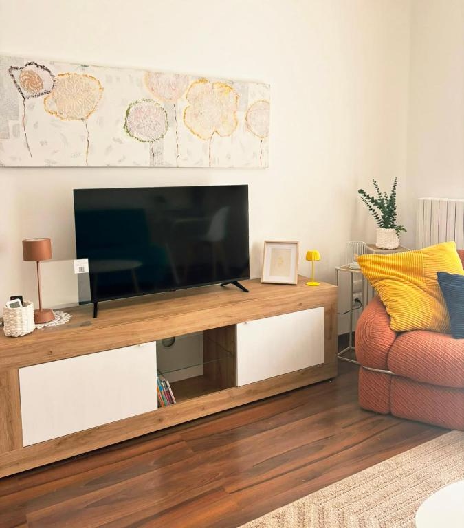 a living room with a flat screen tv and a couch at Casa Dolce Casa in Guardiagrele