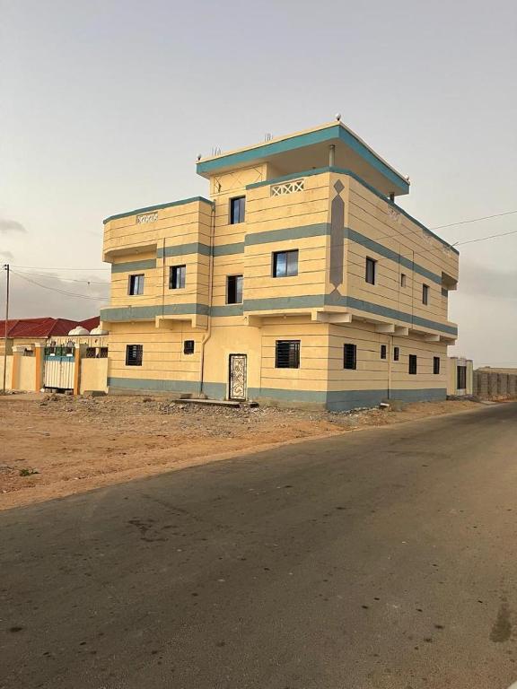 a large building on the side of a road at Berbera aparthotel in Berbera