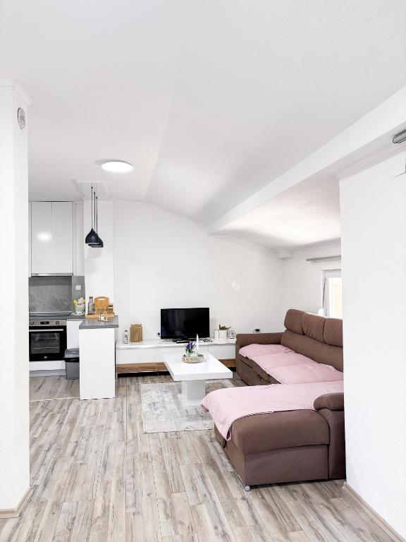 a living room with a couch and a table at Muso Apartments in Gevgelija