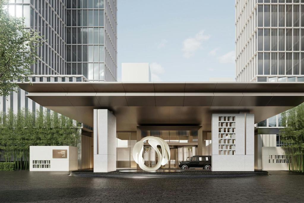 a rendering of a building with a circle in front at Courtyard by Marriott Rizhao in Rizhao
