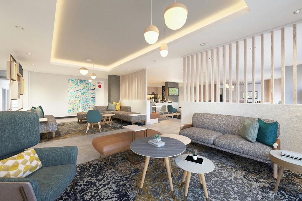 a living room with couches and tables at TownePlace Suites by Marriott Caldwell in Caldwell