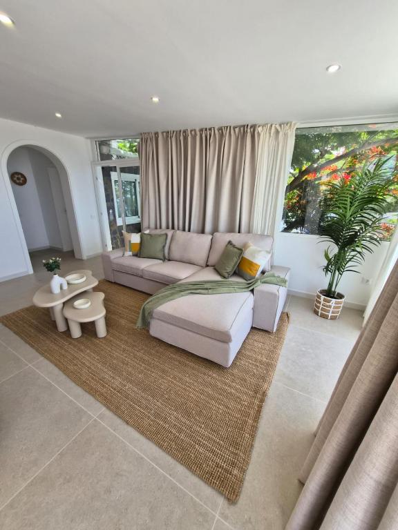 a living room with a couch and a table at Gándara Lodge Luxury in Tijoco de Abajo