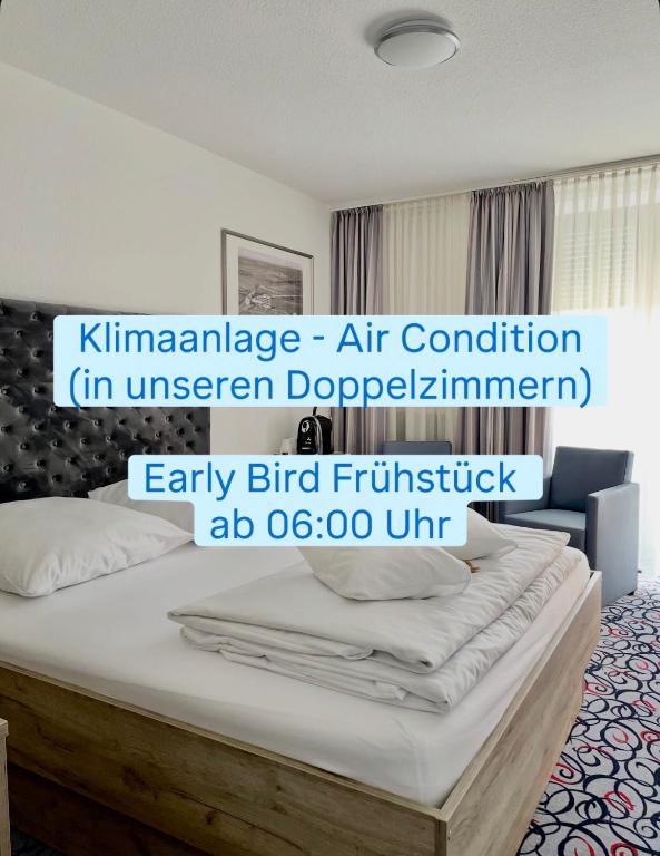 an image of a bedroom with a bed at Hotel Pfefferhöhe Alsfeld in Alsfeld