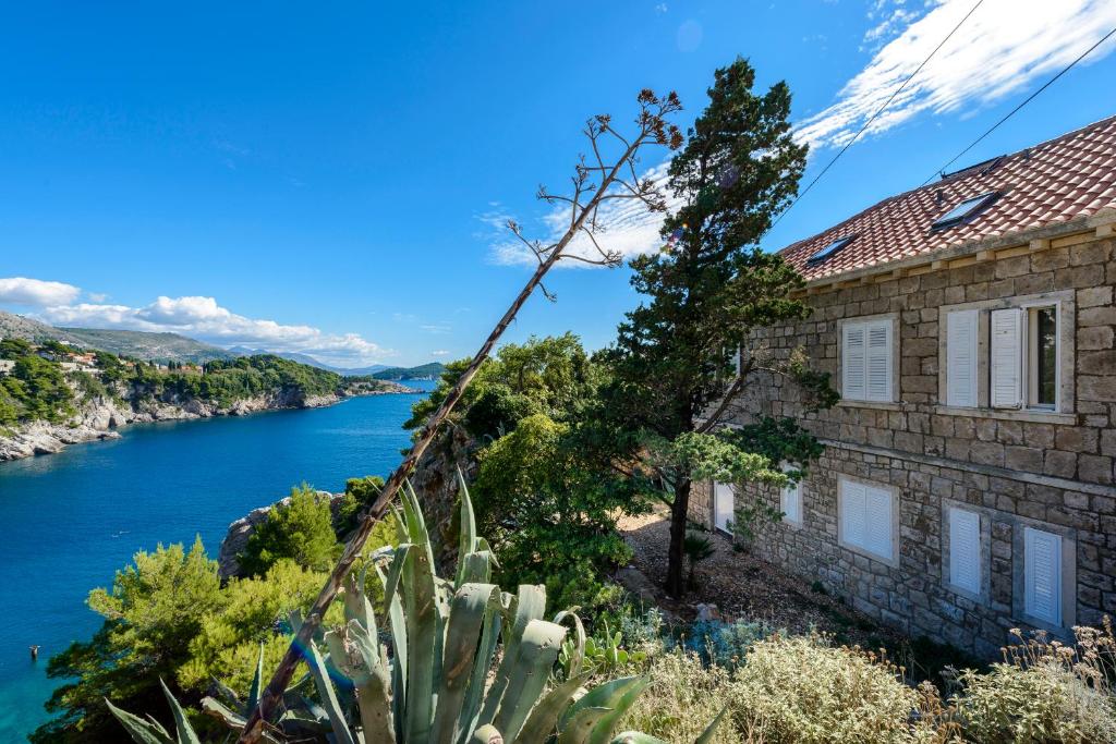 a house with a view of the river at Holiday Home Villa Rosemary in Dubrovnik