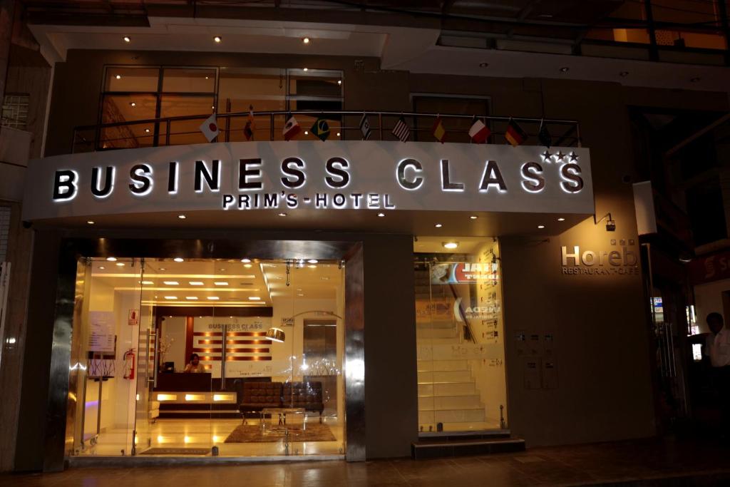 a store front with a sign for a business clades at Business Class Prims Hotel in Jaén