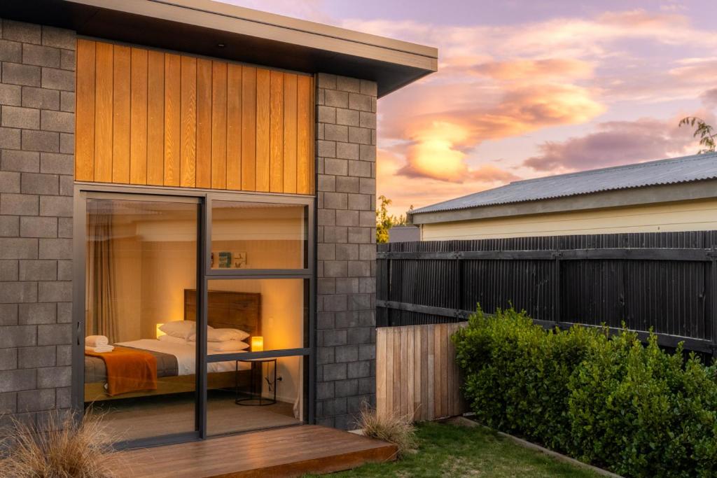 a bedroom in a house with a bed in it at Totara Haven in Twizel