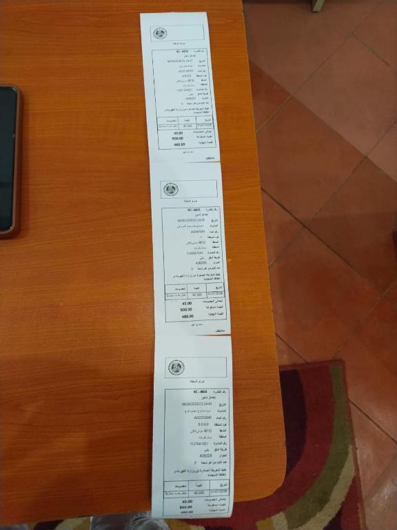 a piece of paper taped to a guitar chord at راس سدر in Ain Sokhna