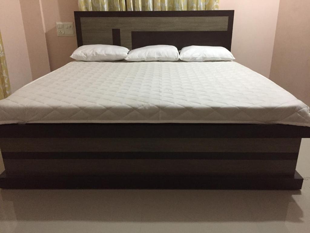 Postel nebo postele na pokoji v ubytování Mega Tourist Home