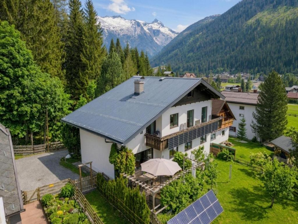 an aerial view of a house with a solar roof at Landhaus Herz der Tauern in Mallnitz