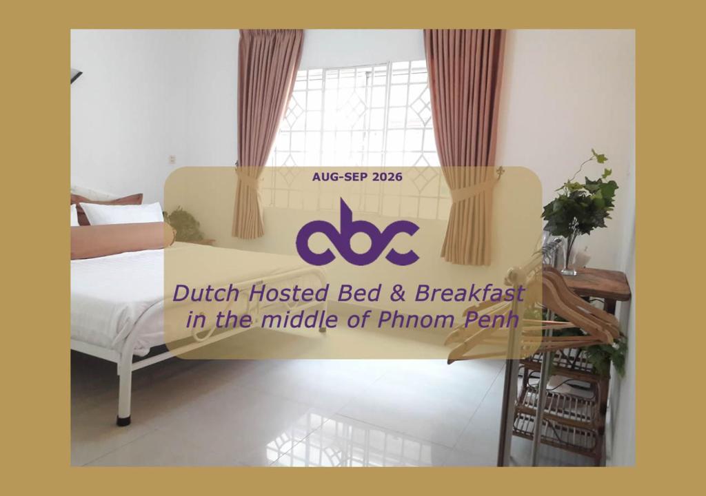 a sign that reads dutchucked bed and breakfast in the middle of a human at Dutch Hosted B&B, ABC in Phnom Penh