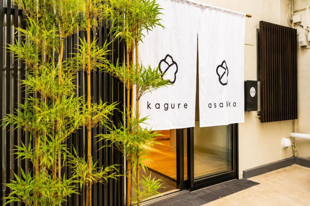 a facade of a store with a sign for kreuziger at kaguya asakusa Women only guest house in Tokyo