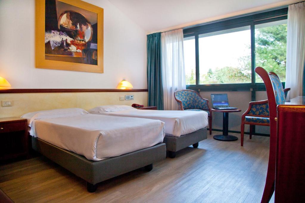 Postel nebo postele na pokoji v ubytování Green Hotel Motel