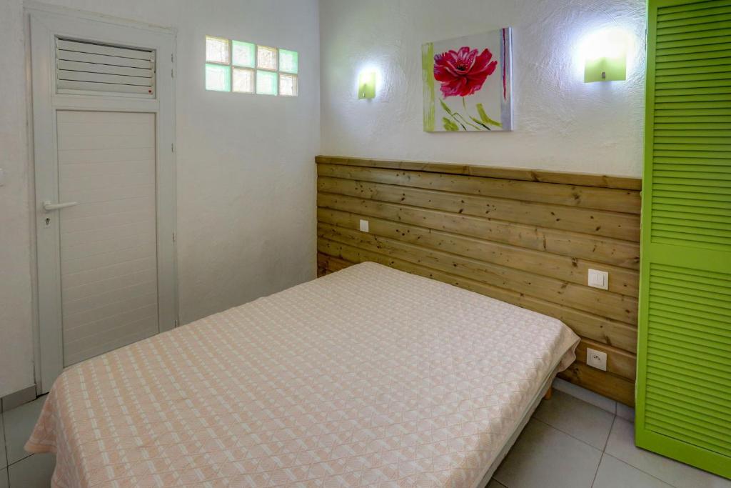 Postel nebo postele na pokoji v ubytování Antilles Liberte