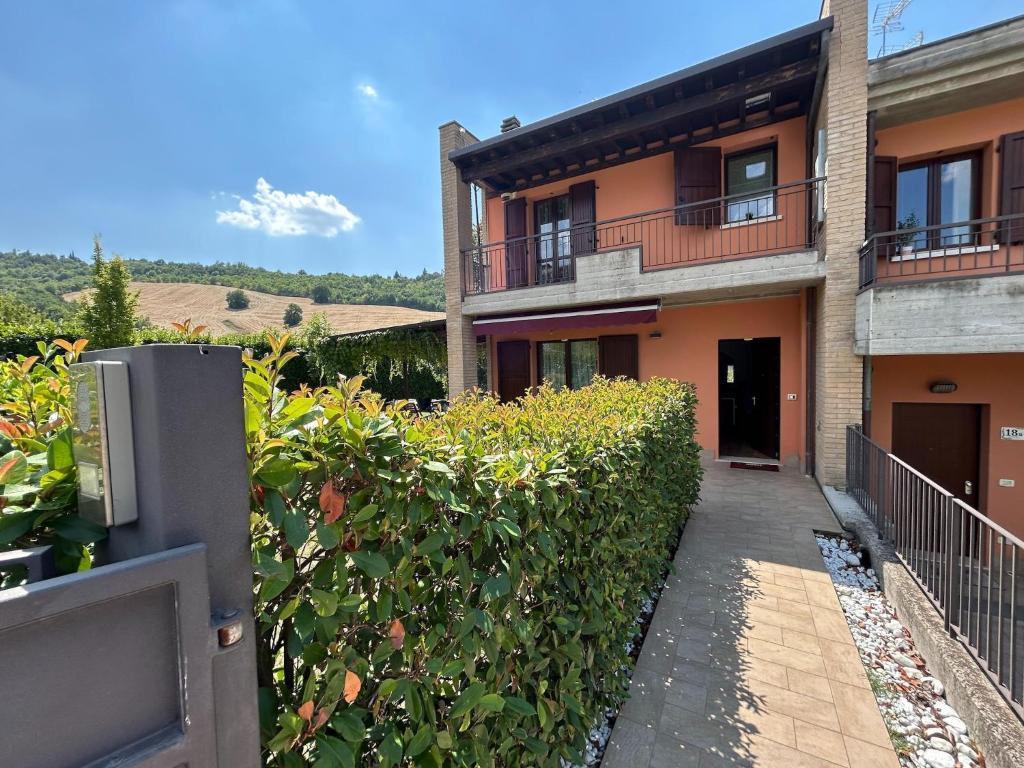 a building with a walkway in front of it at Nice villa with pool and garden in Fermignano