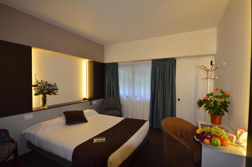 Postel nebo postele na pokoji v ubytování Green Hotel Motel