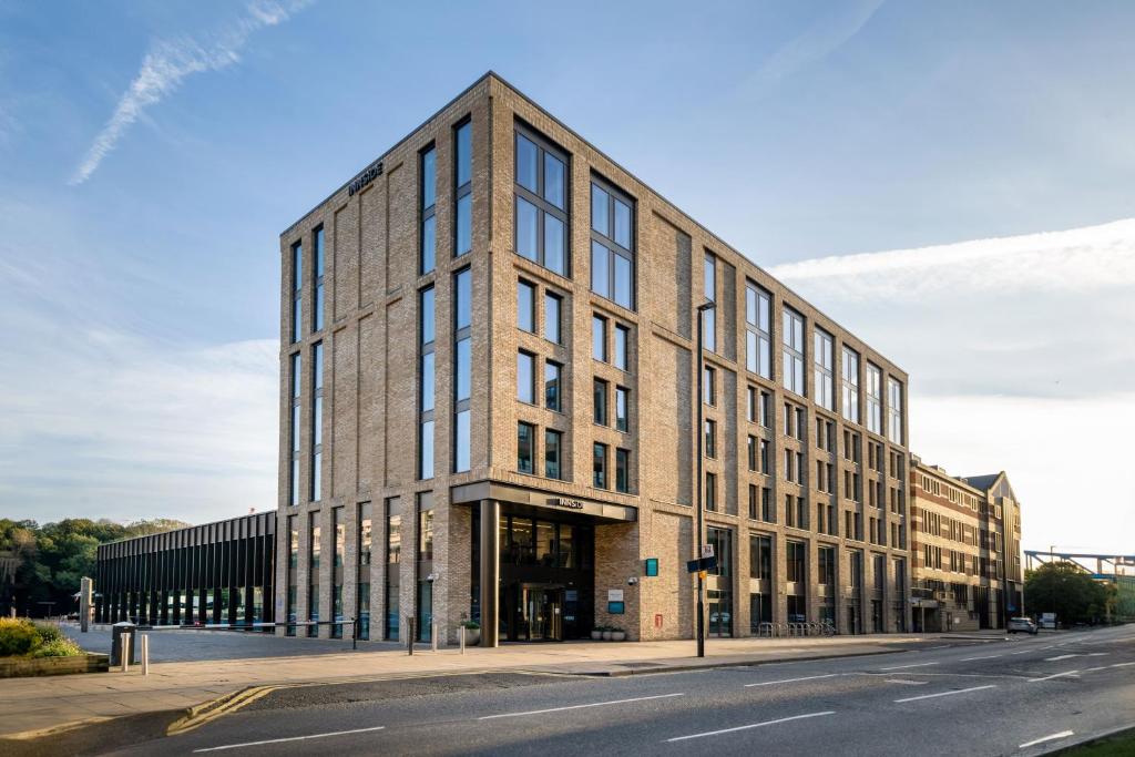 a large brick building on the side of a street at INNSiDE by Meliá Newcastle in Newcastle upon Tyne