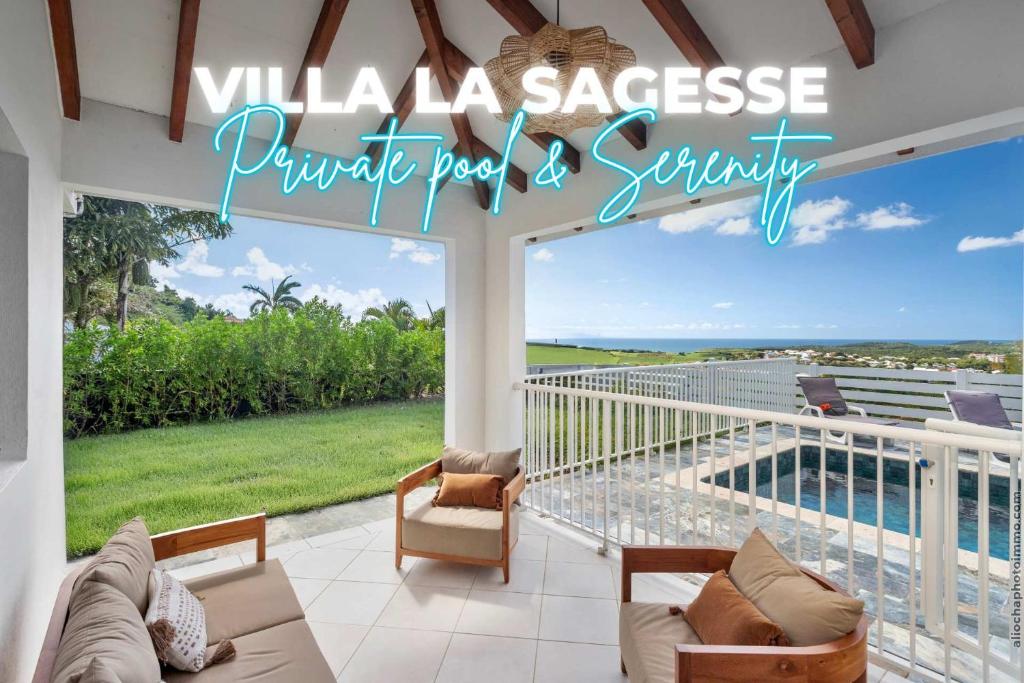 a villaace house with a balcony with a view of the ocean at Villa T4 La Sagesse WS - Piscine Privée in Rivière-Salée