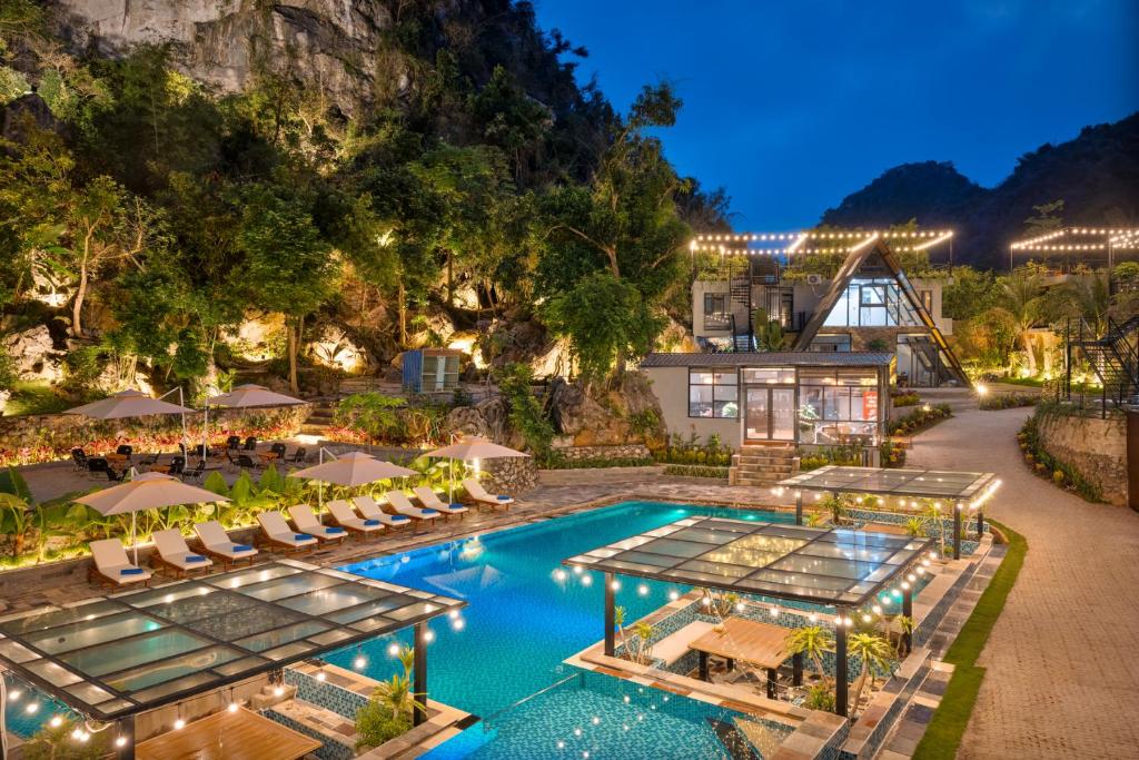 an aerial view of a resort with a swimming pool at Cát Bà Sena Valley Retreat in Xuan Dam