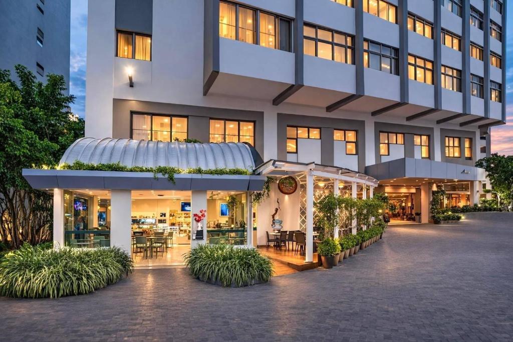 a building with a gazebo in front of it at Radisson Hotel Santo Domingo in Santo Domingo
