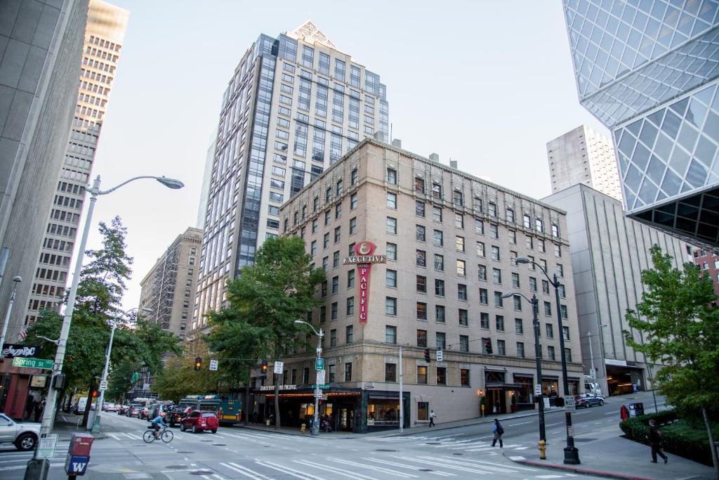 a large building in a city with tall buildings at Executive Hotel Pacific in Seattle