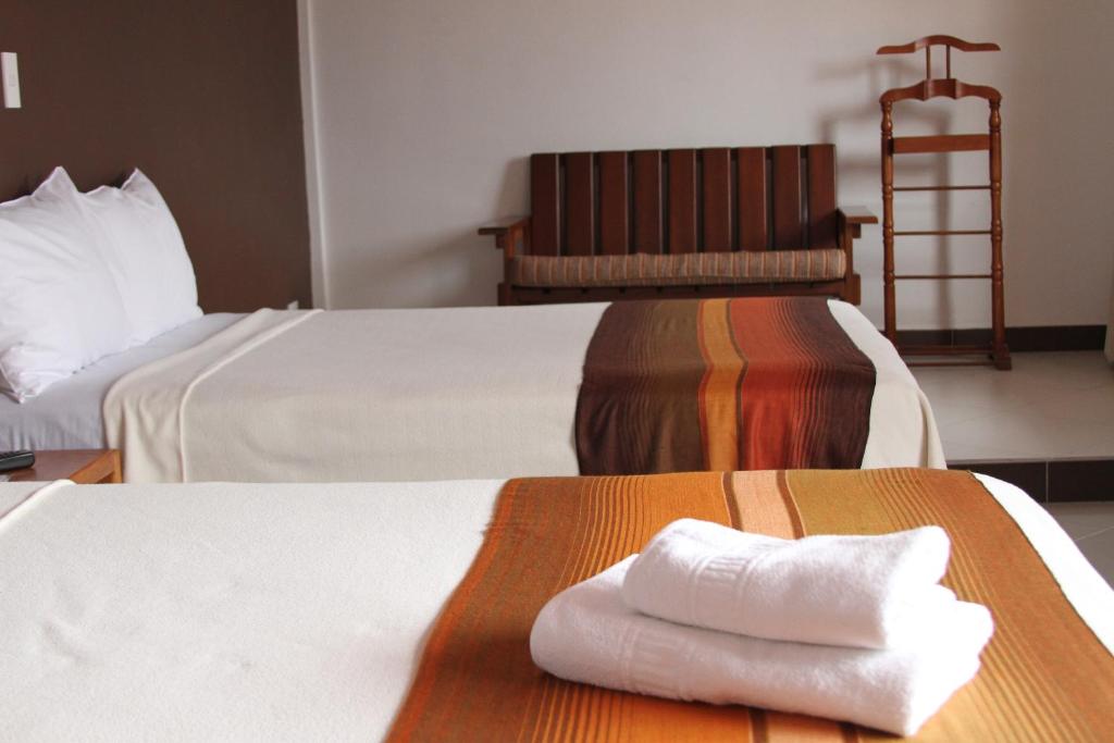 Postel nebo postele na pokoji v ubytování Hotel Casa Sakiwa