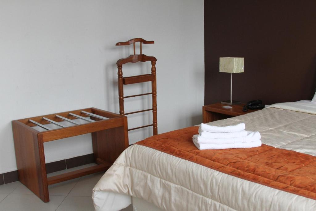 Postel nebo postele na pokoji v ubytování Hotel Casa Sakiwa