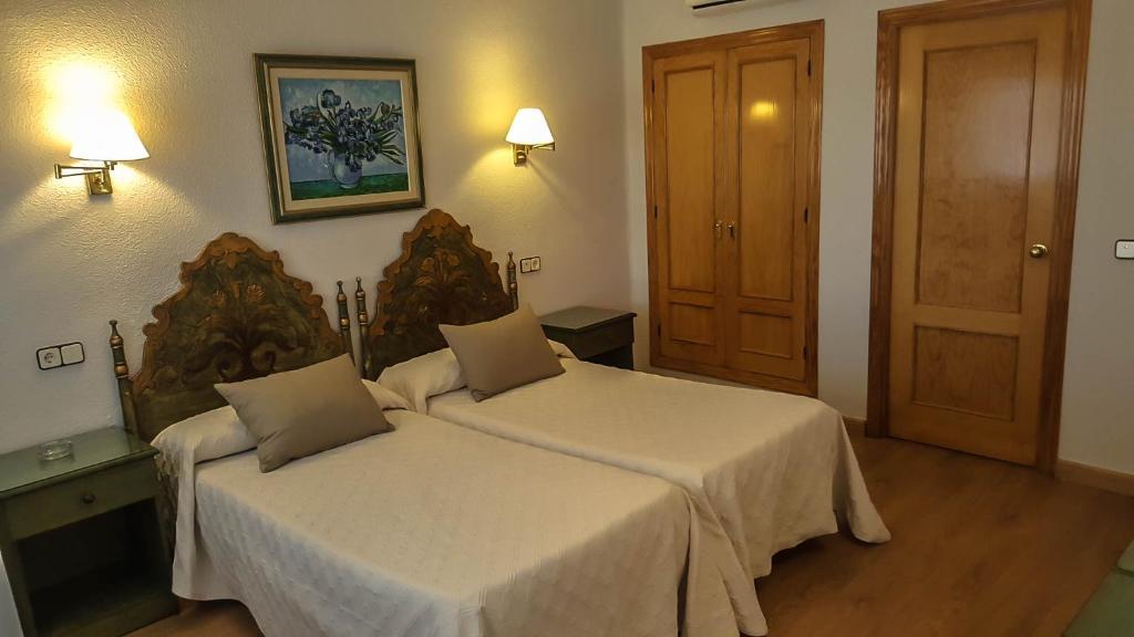 Cama o camas de una habitación en Hotel Salvador