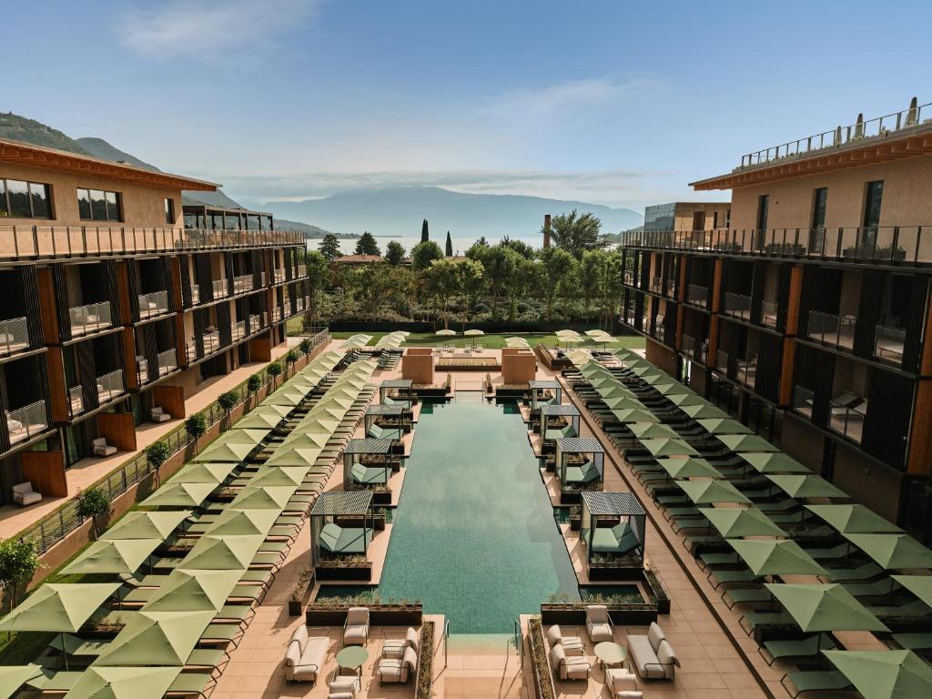 a view of the pool at a resort at Falkensteiner Resort Lake Garda in Salò