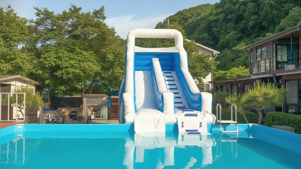 a water slide in the middle of a pool at Gapeong Jason Spa Pension in Gapyeong