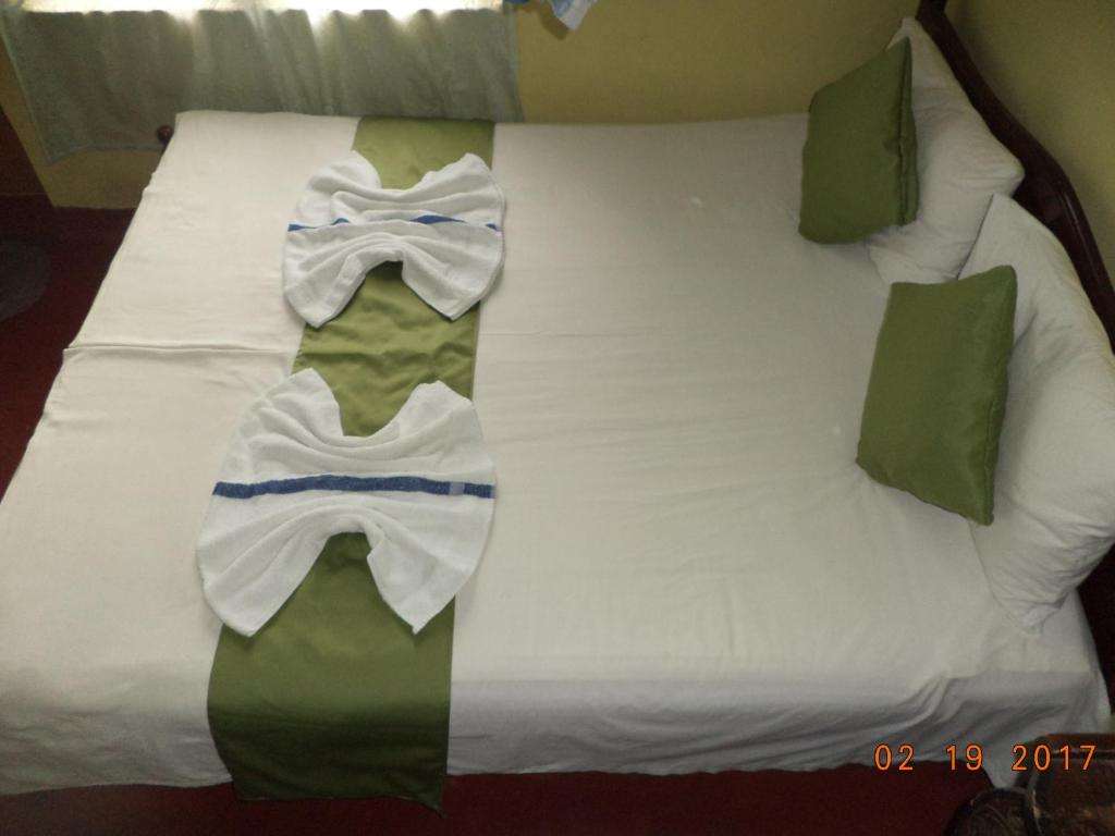 Postel nebo postele na pokoji v ubytování Raja174 Homestay
