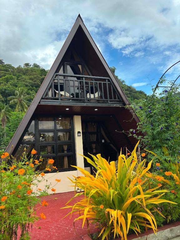 a small house with a gambrel roof at Casa Carmelita in Batangas City